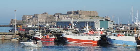 Castle behind boats