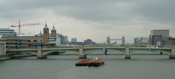 Barge passing under the bridge