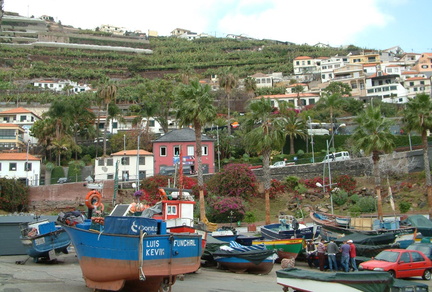 Boats in front of the hillside