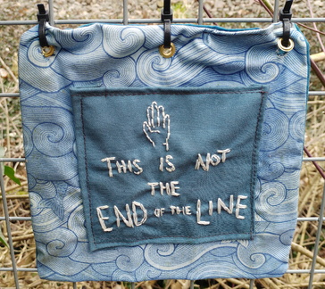 Embroidered sign