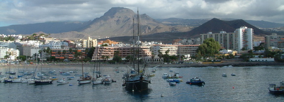 Mountains behind boats