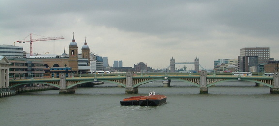 Barge passing under the bridge