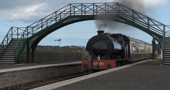 Train under bridge