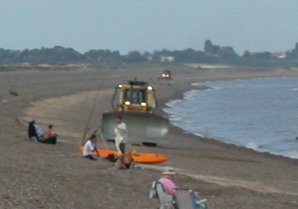 Bulldozer and boat