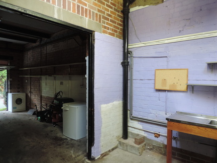 Along the garage